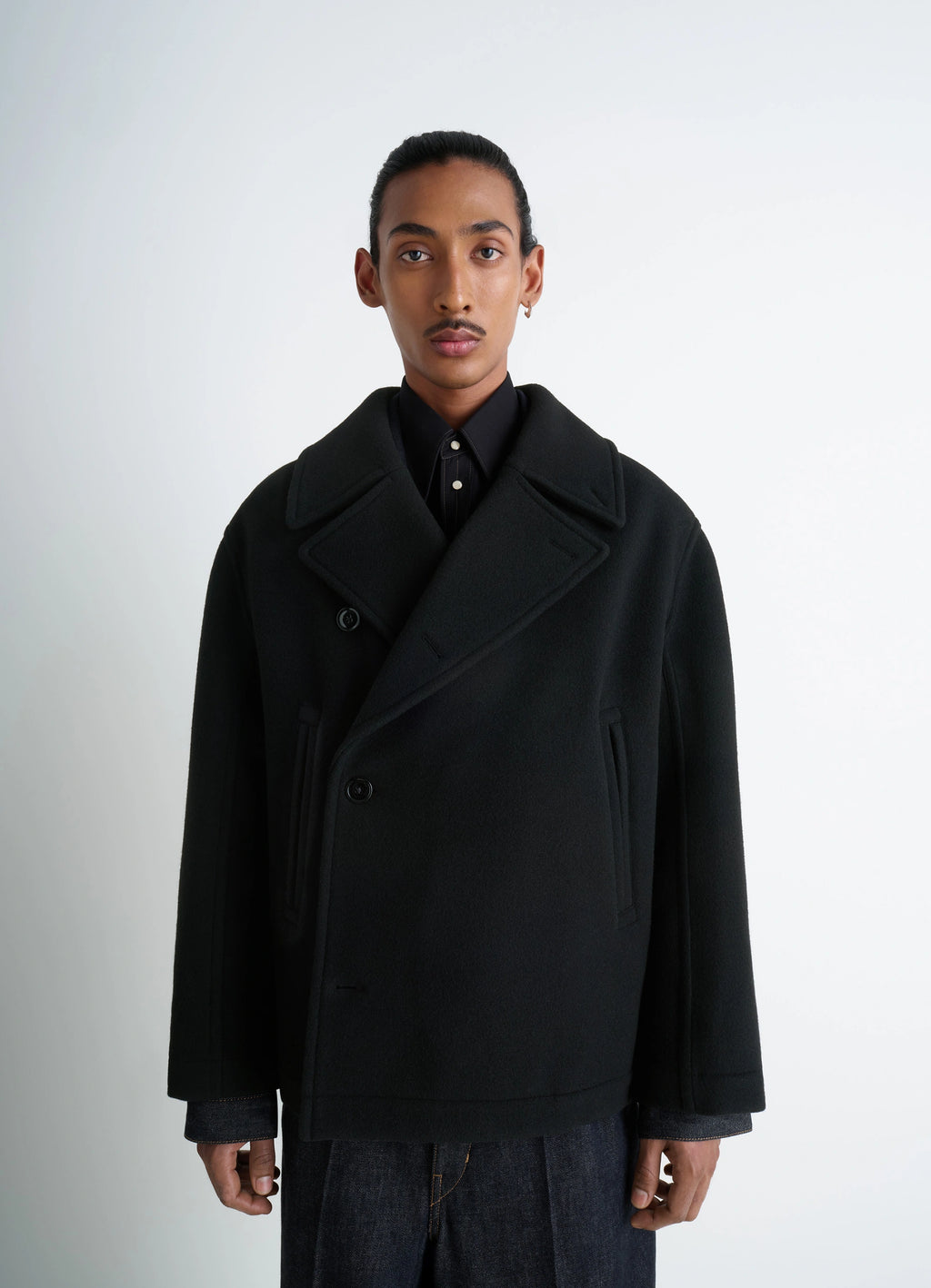 Lemaire Boxy Peacoat in Black Double-Faced Wool, model shot, close-up front view notched lapel