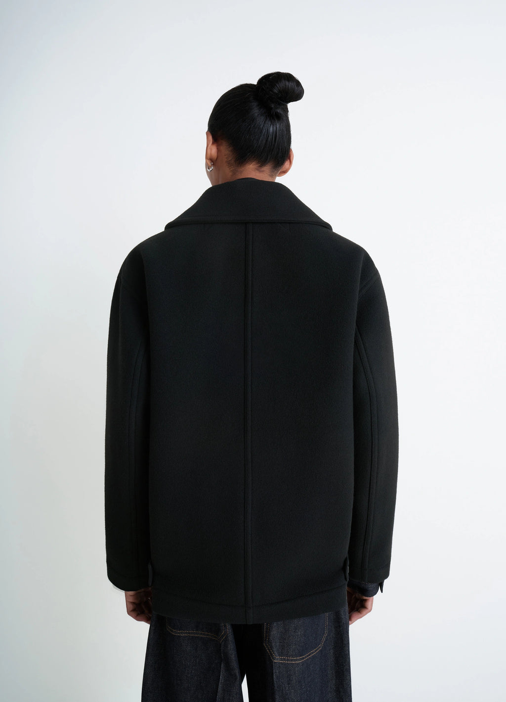 Lemaire Boxy Peacoat in Black Double-Faced Wool, model shot, rear back view high collar single vent