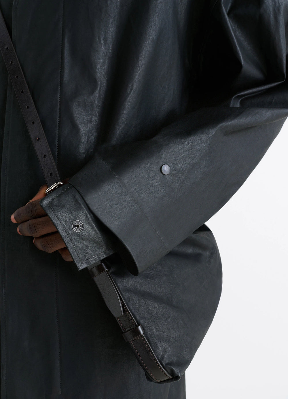 Hooded Raincoat in Water-repellent Resinated Cotton, model shot, detail shot cuff with snap button