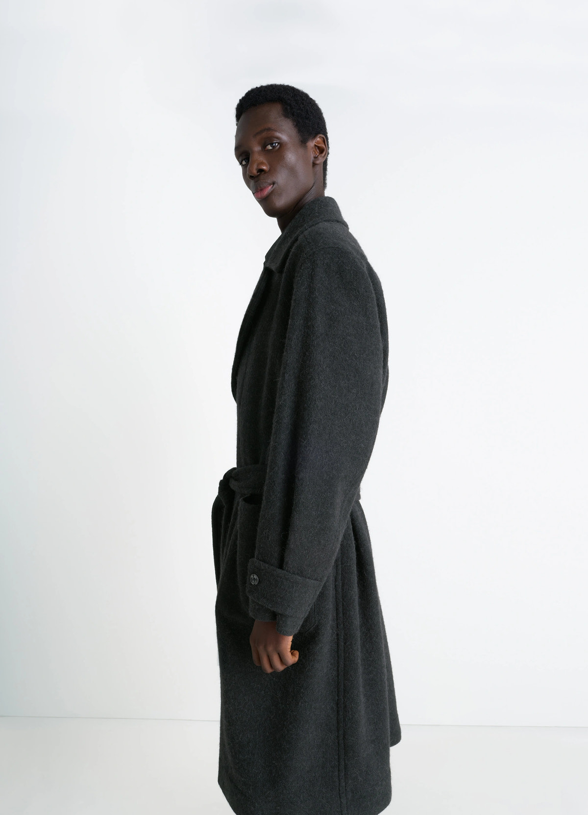 Soft coat in dark wool alpaca blend, model shot, three-quarter view notched lapel