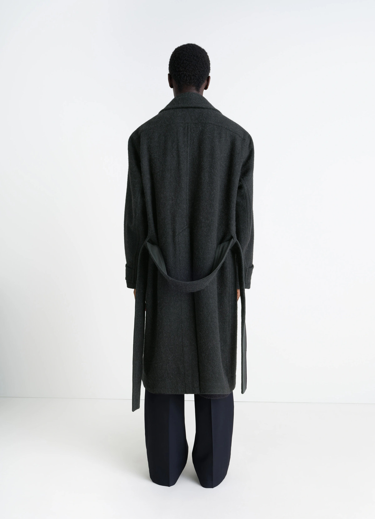 Soft coat in dark wool alpaca blend, model shot, back view rear belt detailing