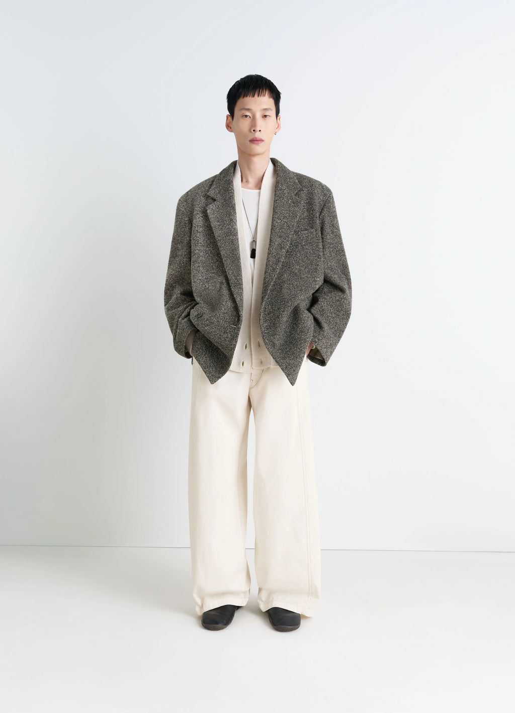 Short Double Breasted Coat in Mottled Wool Tweed, model shot, three-quarter view oversized silhouette