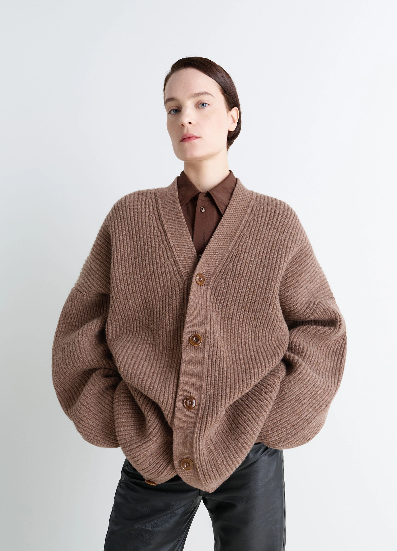 Cardicoat in brown shetland wool, model shot, three-quarter view oversized sleeves