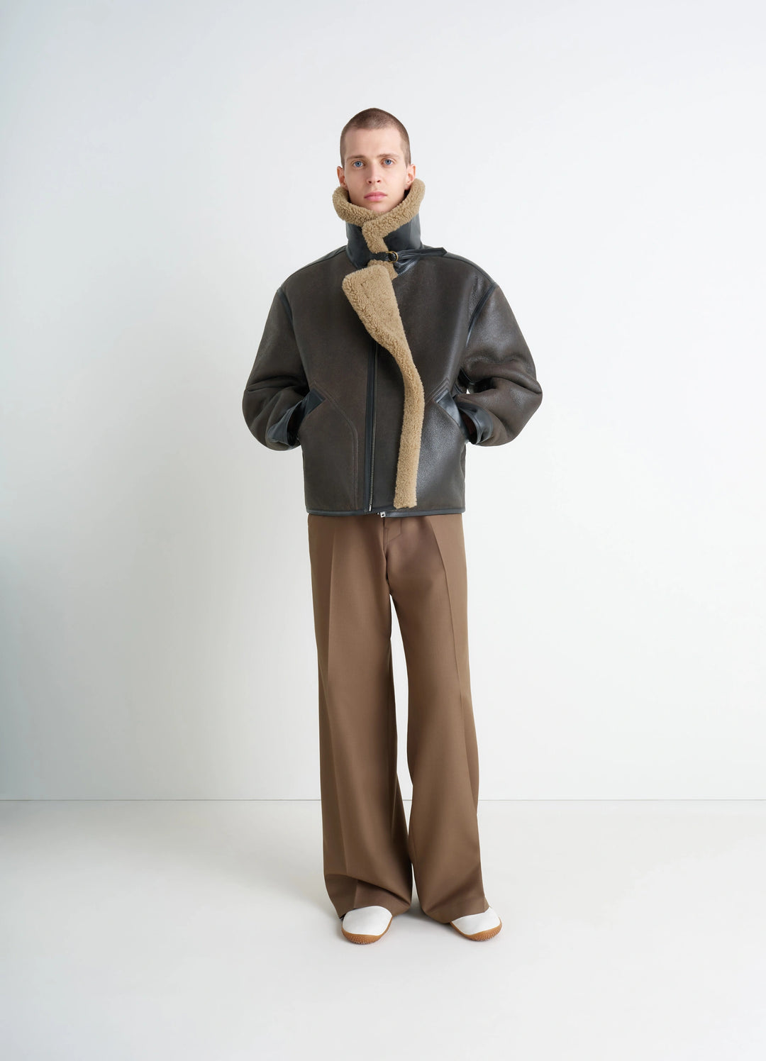 Shearling Coat in Contrasting Leather Trim, model shot, Front View Generous Collar Metal Buckle
