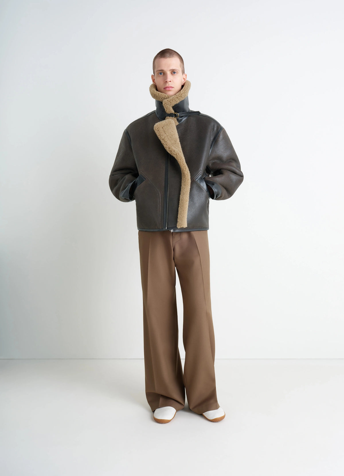 Shearling Coat in Contrasting Leather Trim, model shot, Front View Generous Collar Metal Buckle