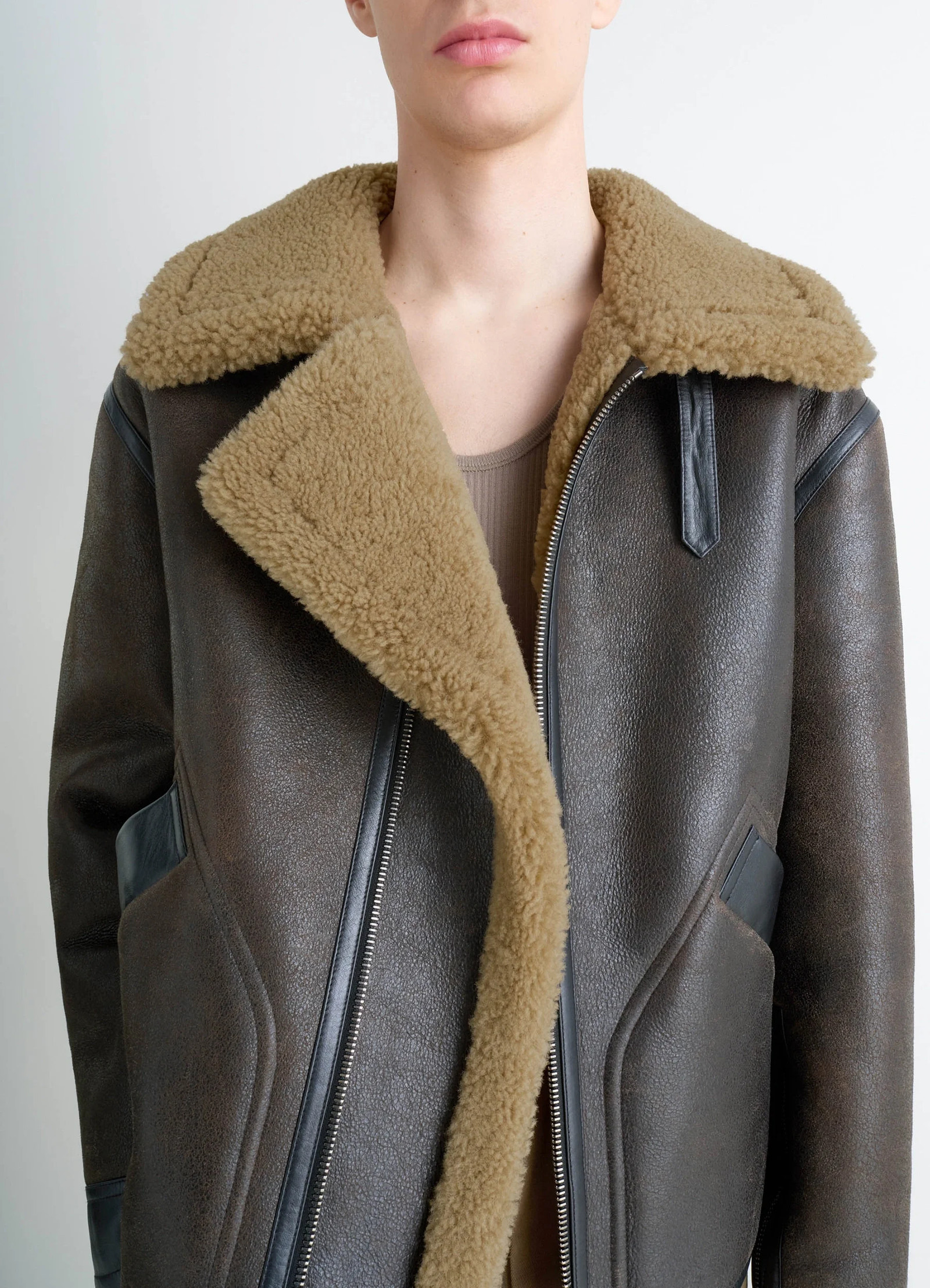 Shearling coat in contrasting leather trim, model shot, mid-length front view open collar ensemble