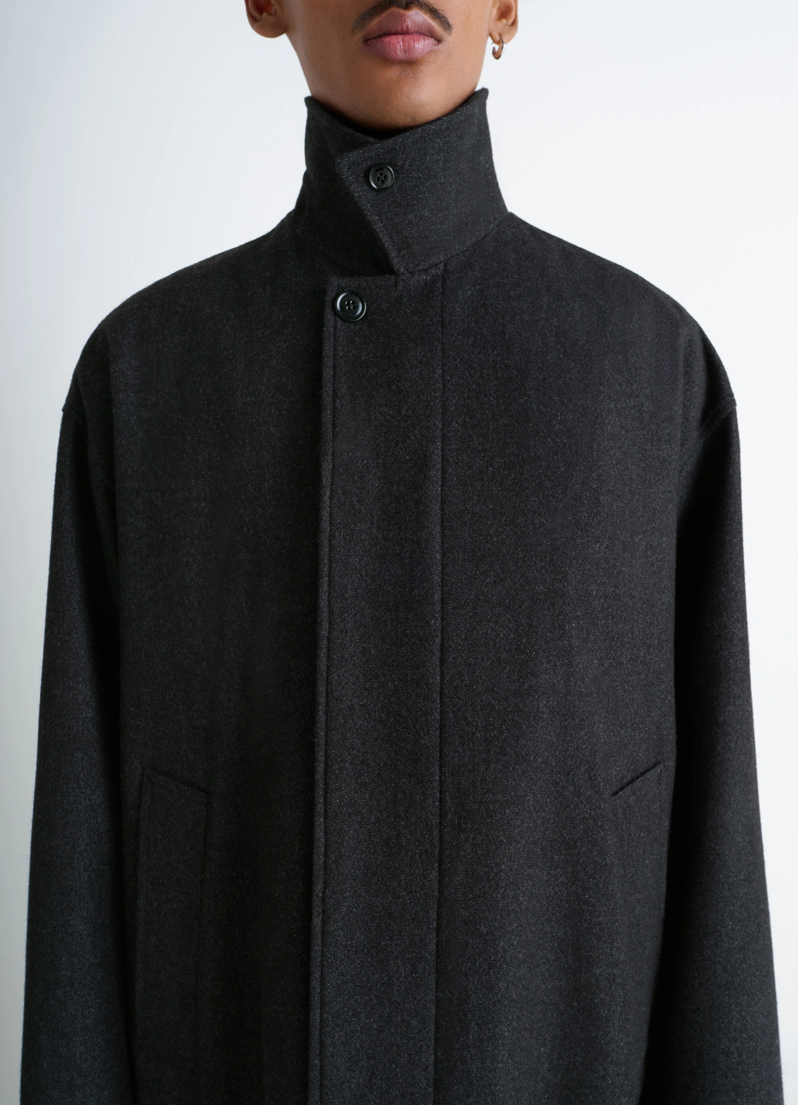 Oversized overcoat in rws wool blend twill, model shot, detail shot of collar high collar, buttoned neck