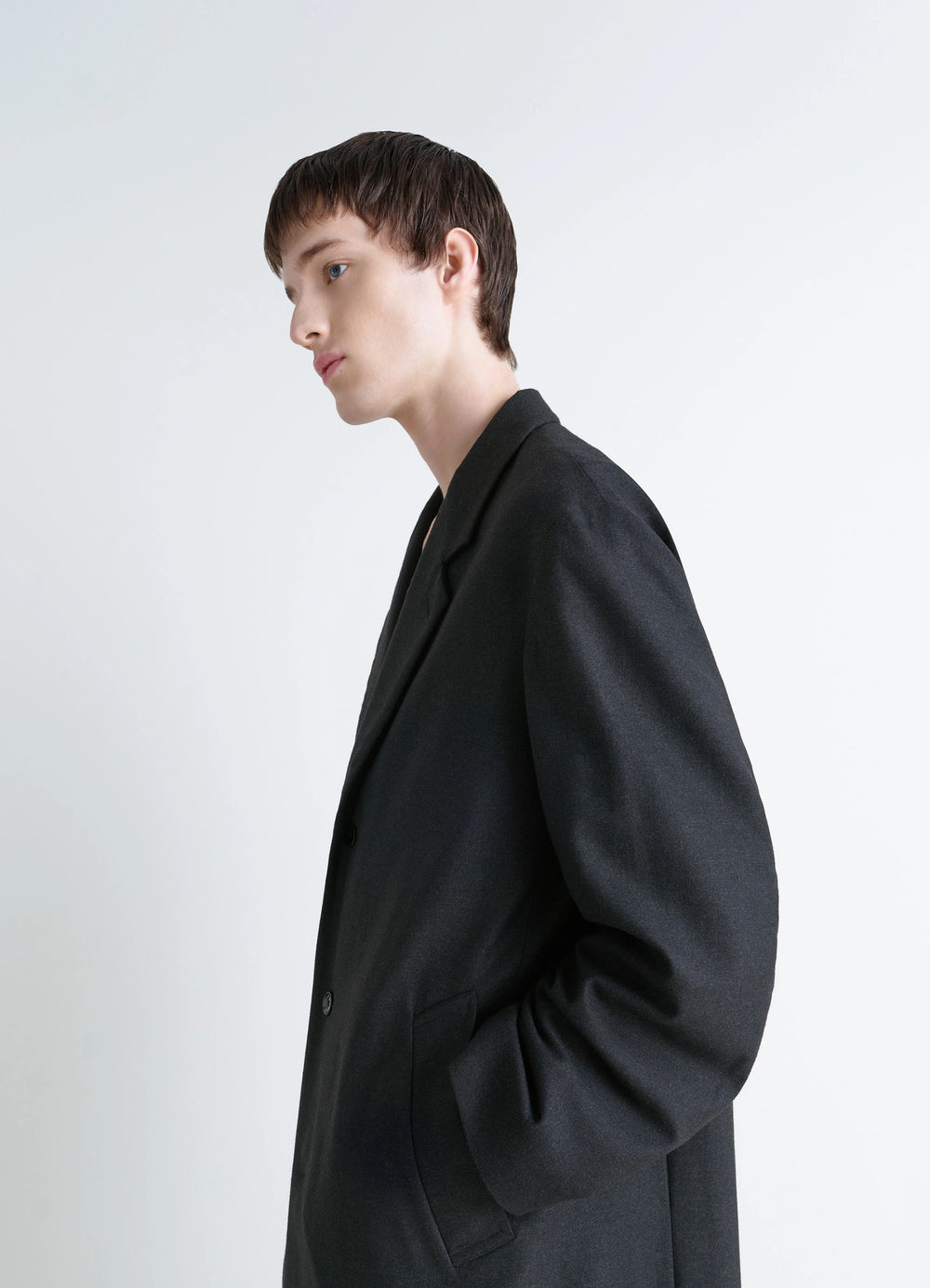 Lemaire Soft Chesterfield Coat in Light Cashmere-Blend, model shot, side profile view collar detail visible