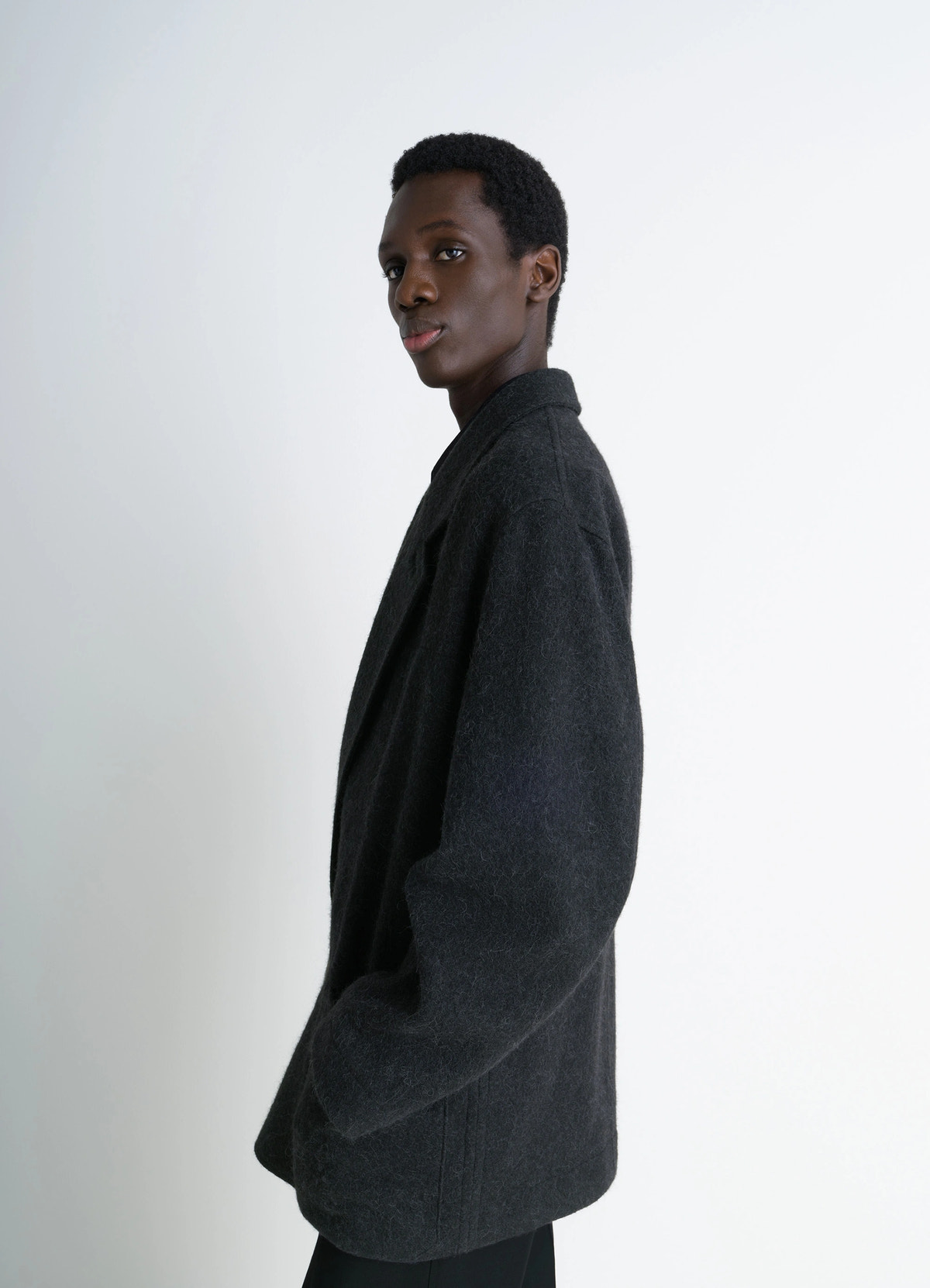 Felt wool jacket in wool and alpaca blend, model shot, right side view oversized fit with lapels