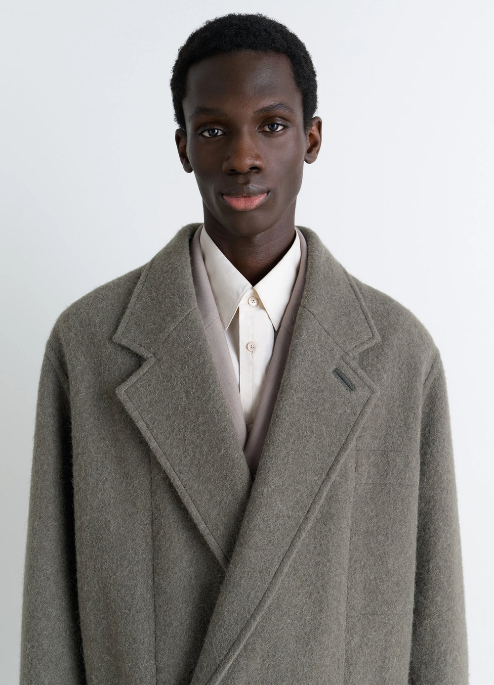 Lemaire Felt Wool Jacket in Olive Wool and Alpaca, model shot, upper body close-up notch lapel texture