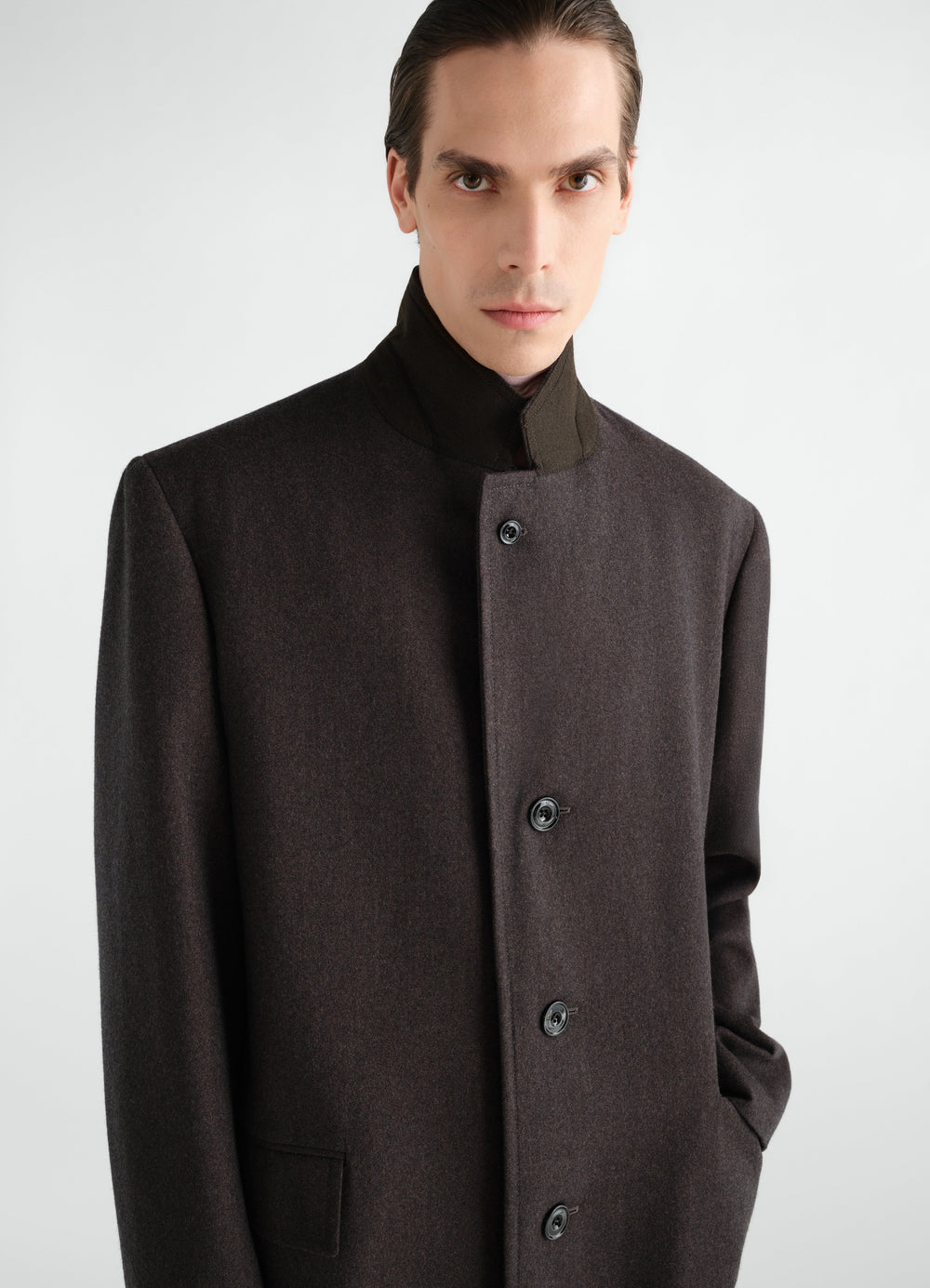 Soft Chesterfield coat in dark brown wool and cotton twill by LEMAIRE worn by model front view close-up