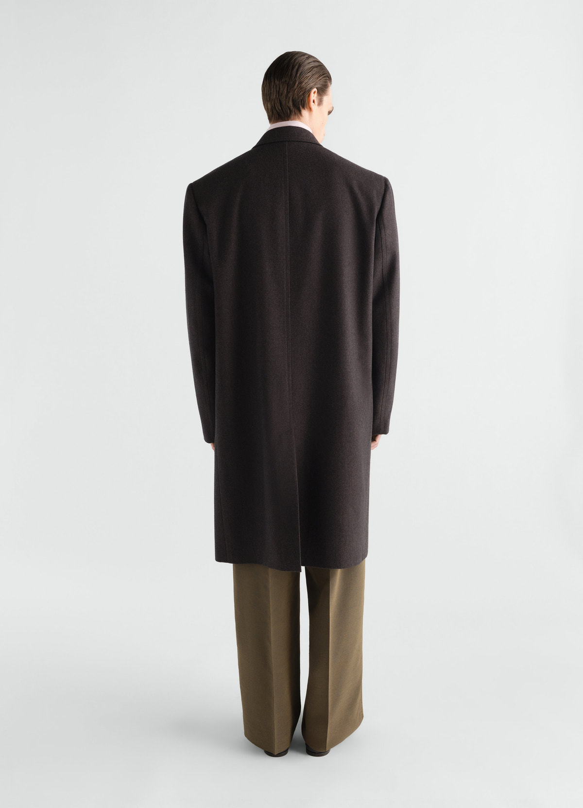 Soft chesterfield coat in dark brown wool and cotton twill worn by model back view lemaire
