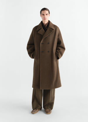 Double-breasted felted wool and alpaca blend coat in brown worn by model front view lemaire