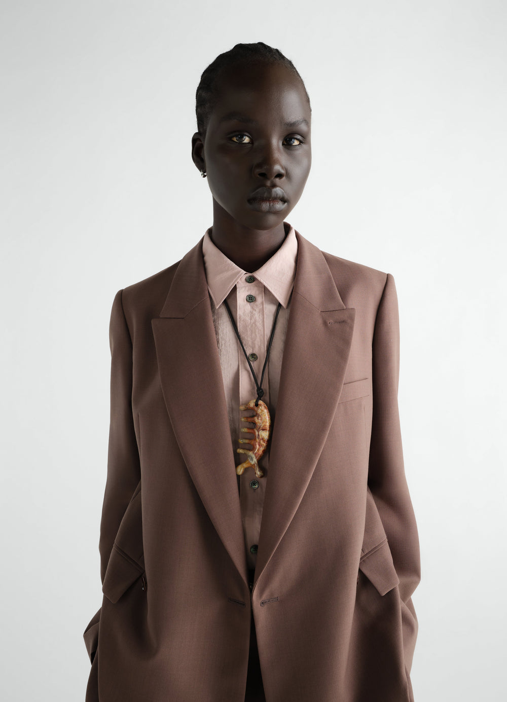 Beluga Gua Sha necklace in yellow jasper worn by a model front view LEMAIRE