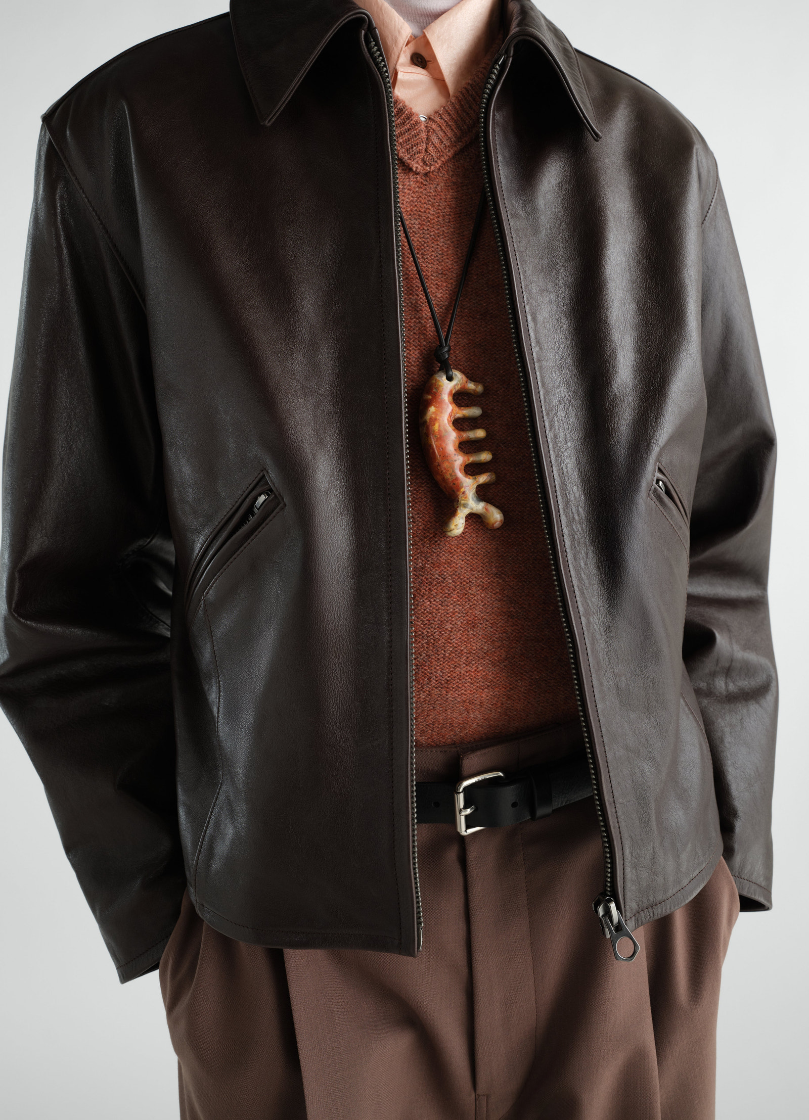 Beluga yellow jasper gemstone necklace lemaire worn by model with brown leather jacket and rust knitwear