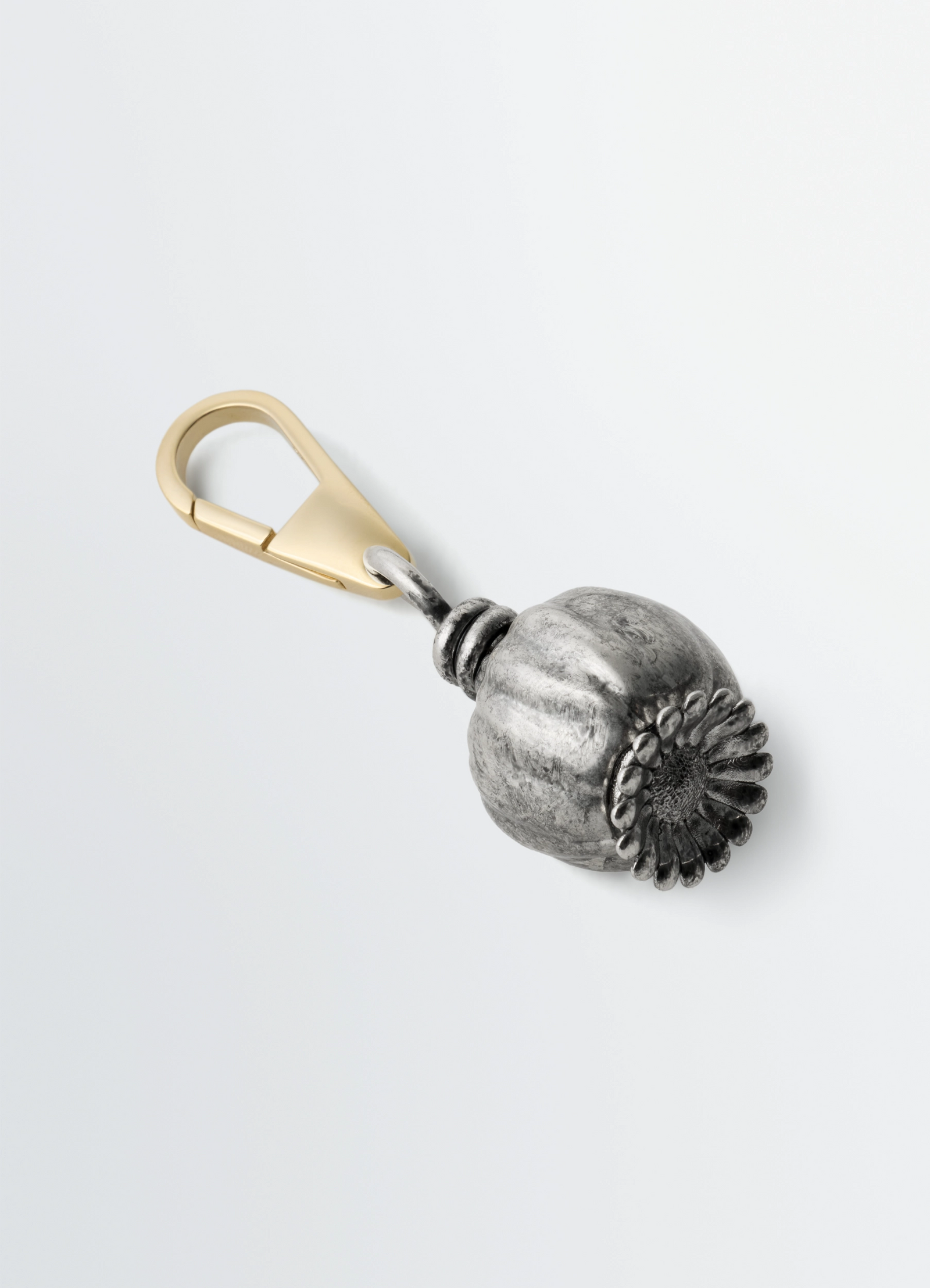 Lemaire maxi thistle bag charm in silver antiqued metal, product shot, angled overhead view decorative thistle seed head