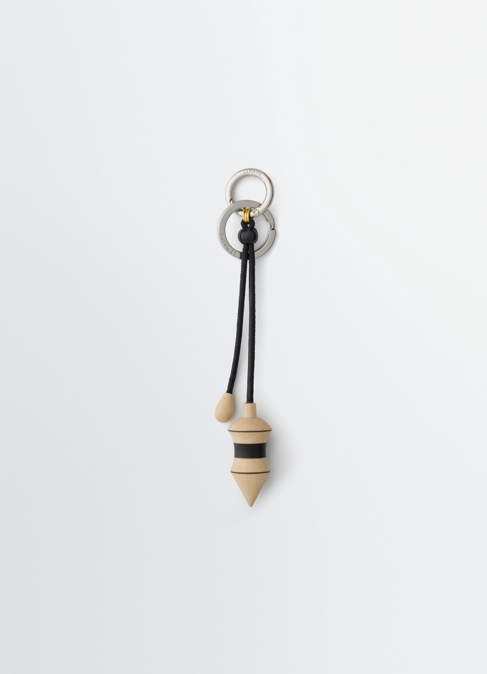 Pendulum bag charm in black stripes wood, product shot, front view carabiner attachment