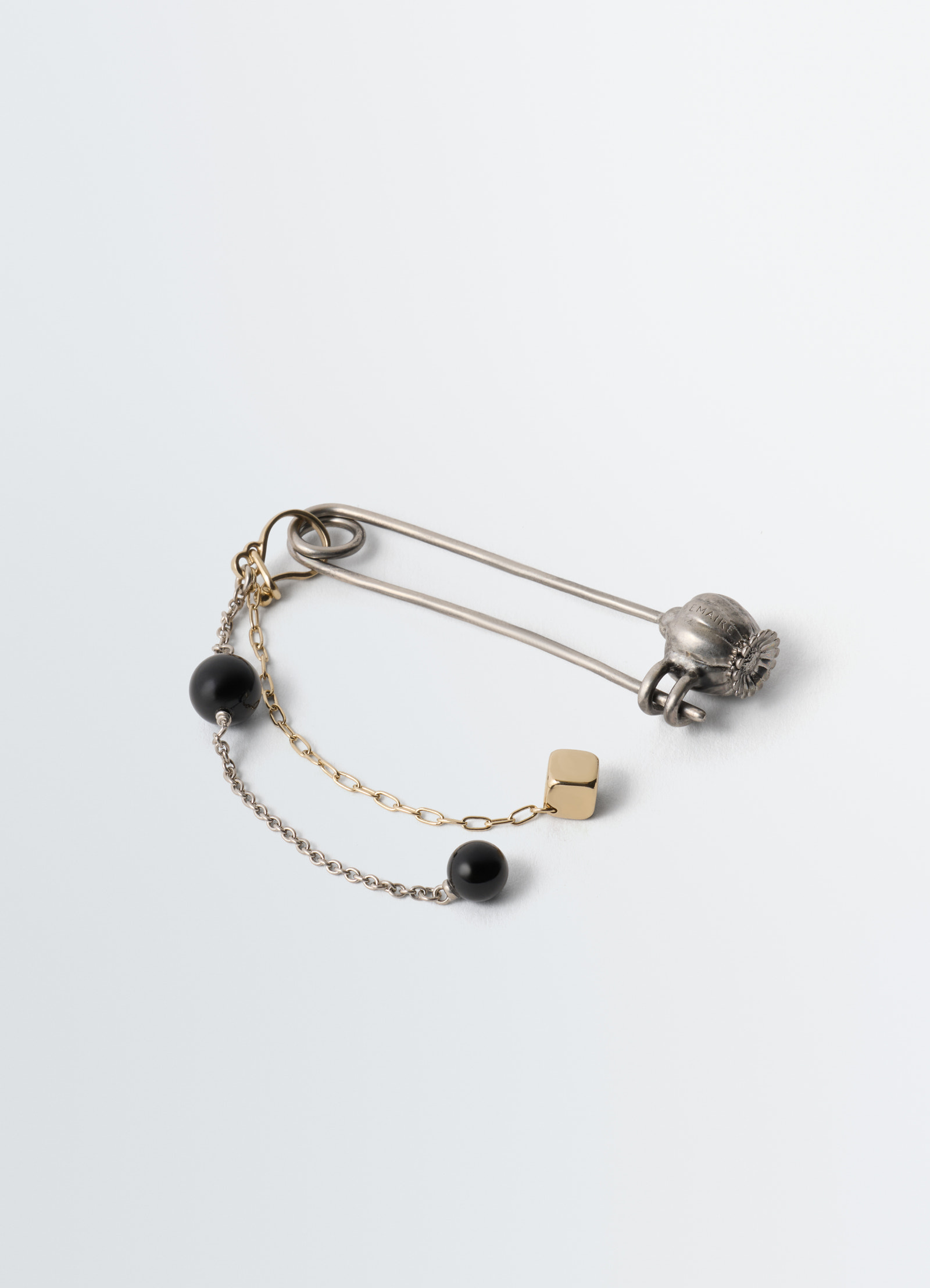 Thistle pin bag charm silver metal with gold chain and black onyx beads by lemaire on white background