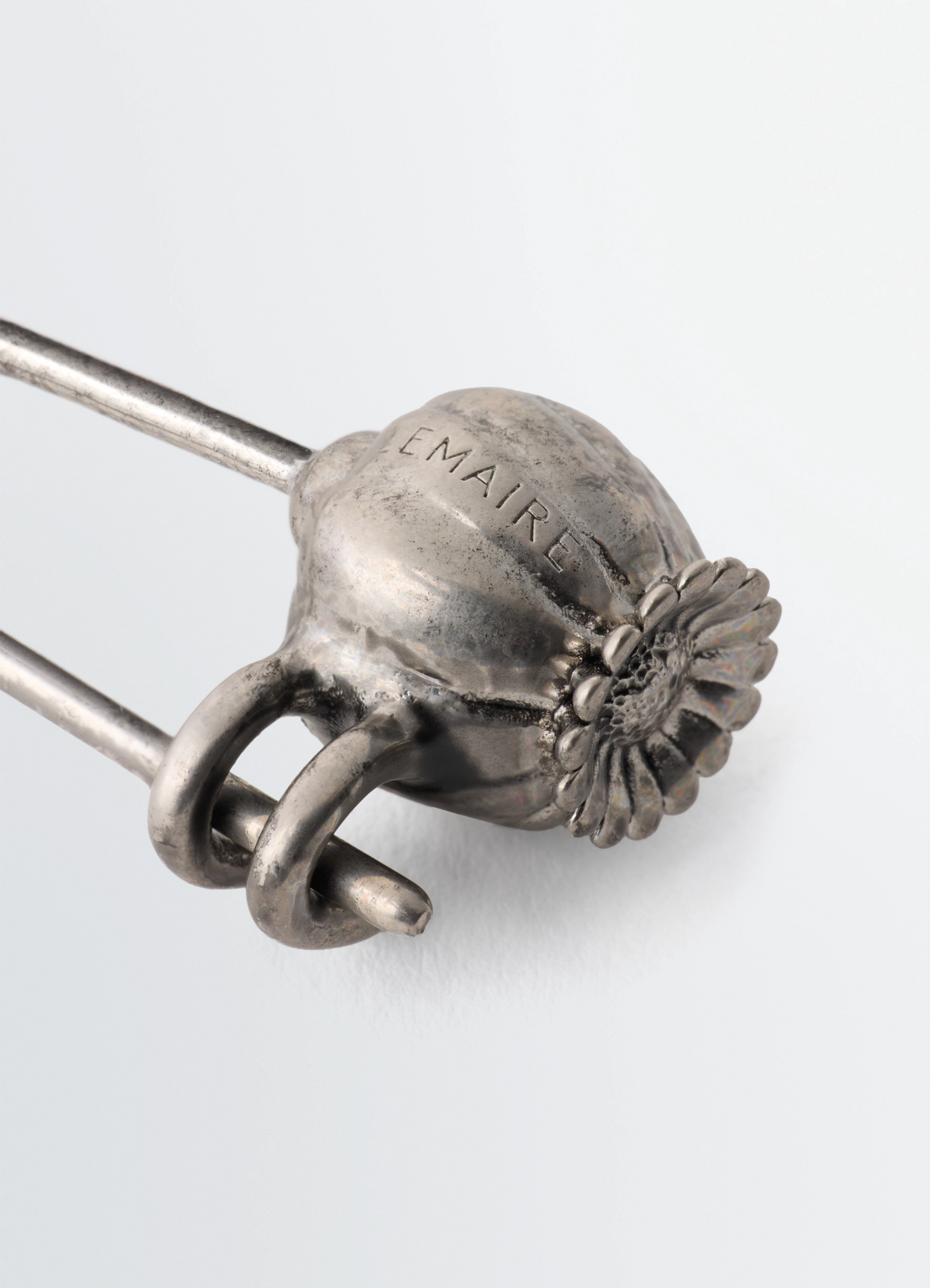 Thistle pin bag charm in with onyx bead, product shot, angled close-up view engraved brand detail