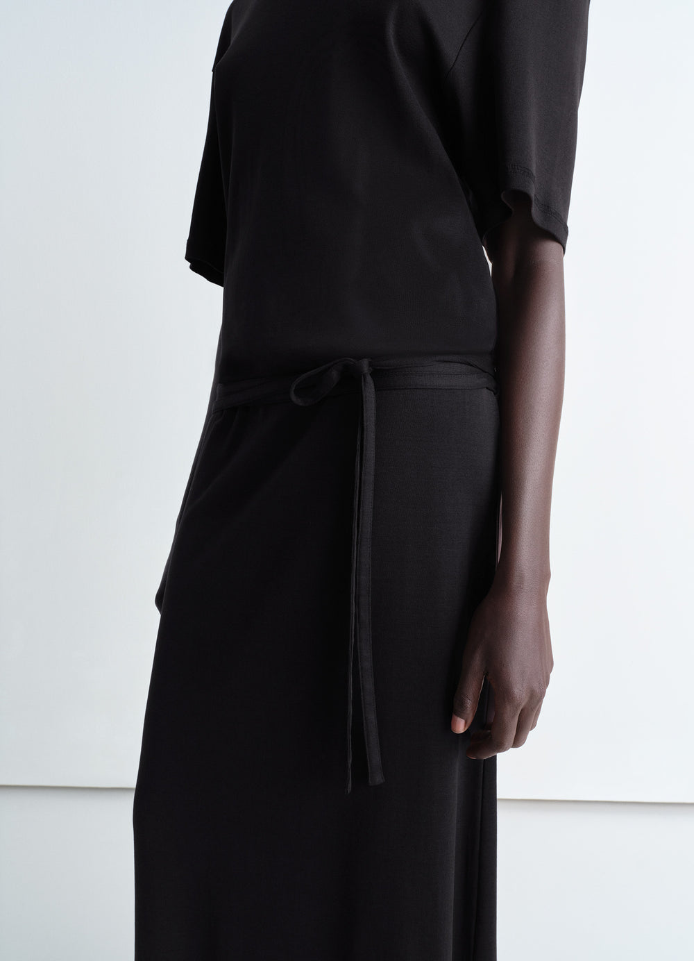 Lemaire Belted Rib T-shirt Dress in Cotton jersey rib, model shot, waist-up side detail short sleeves belted waist