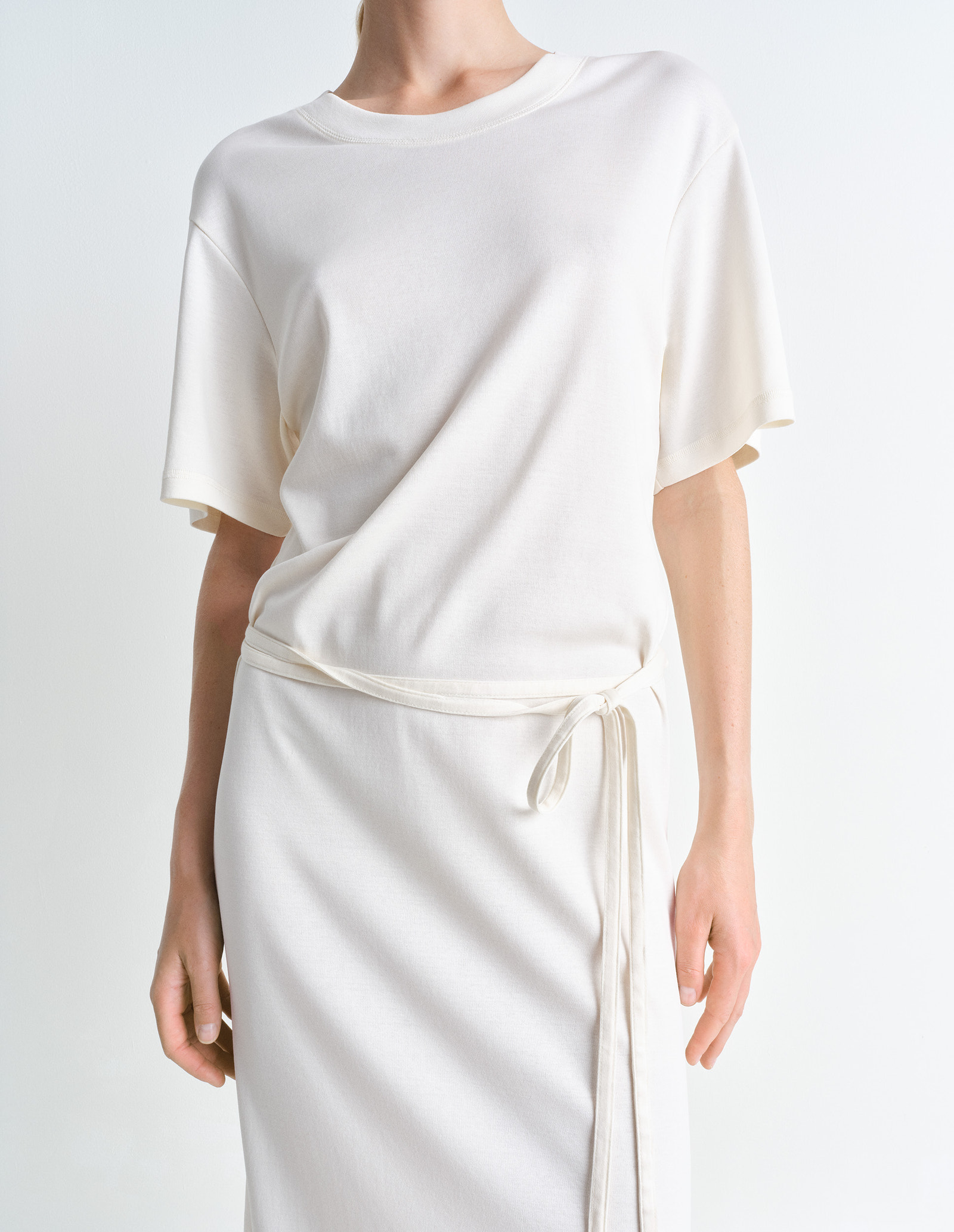 Lemaire belted rib t-shirt dress in mid-weight cotton jersey, model shot, close-up side view short sleeves with tie belt