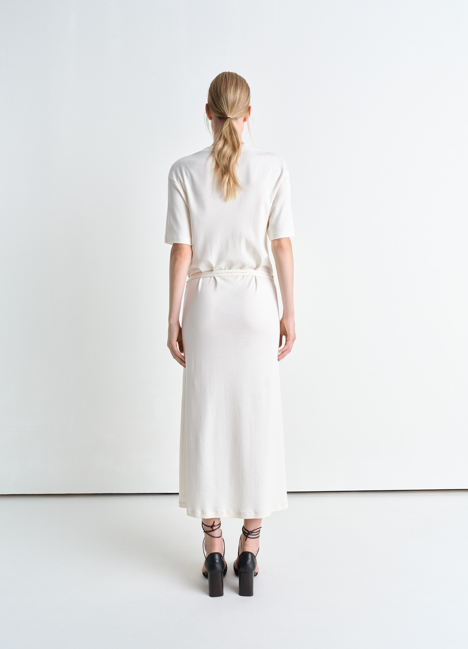 Lemaire belted rib t-shirt dress in mid-weight cotton jersey, model shot, back view ankle-length with belt