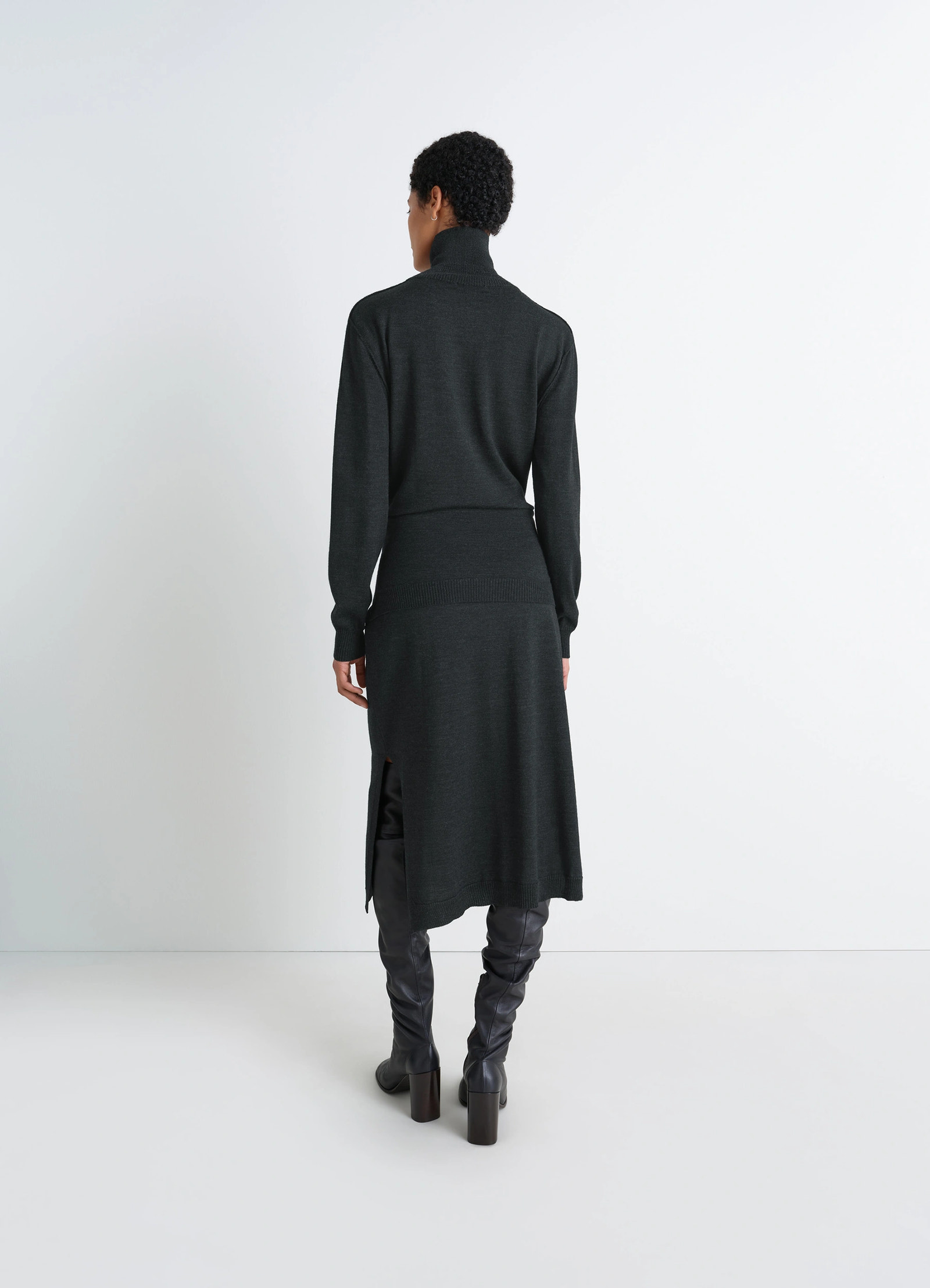 Lemaire trompe loeil dress in dark merino wool blend, model shot, back view high turtleneck back