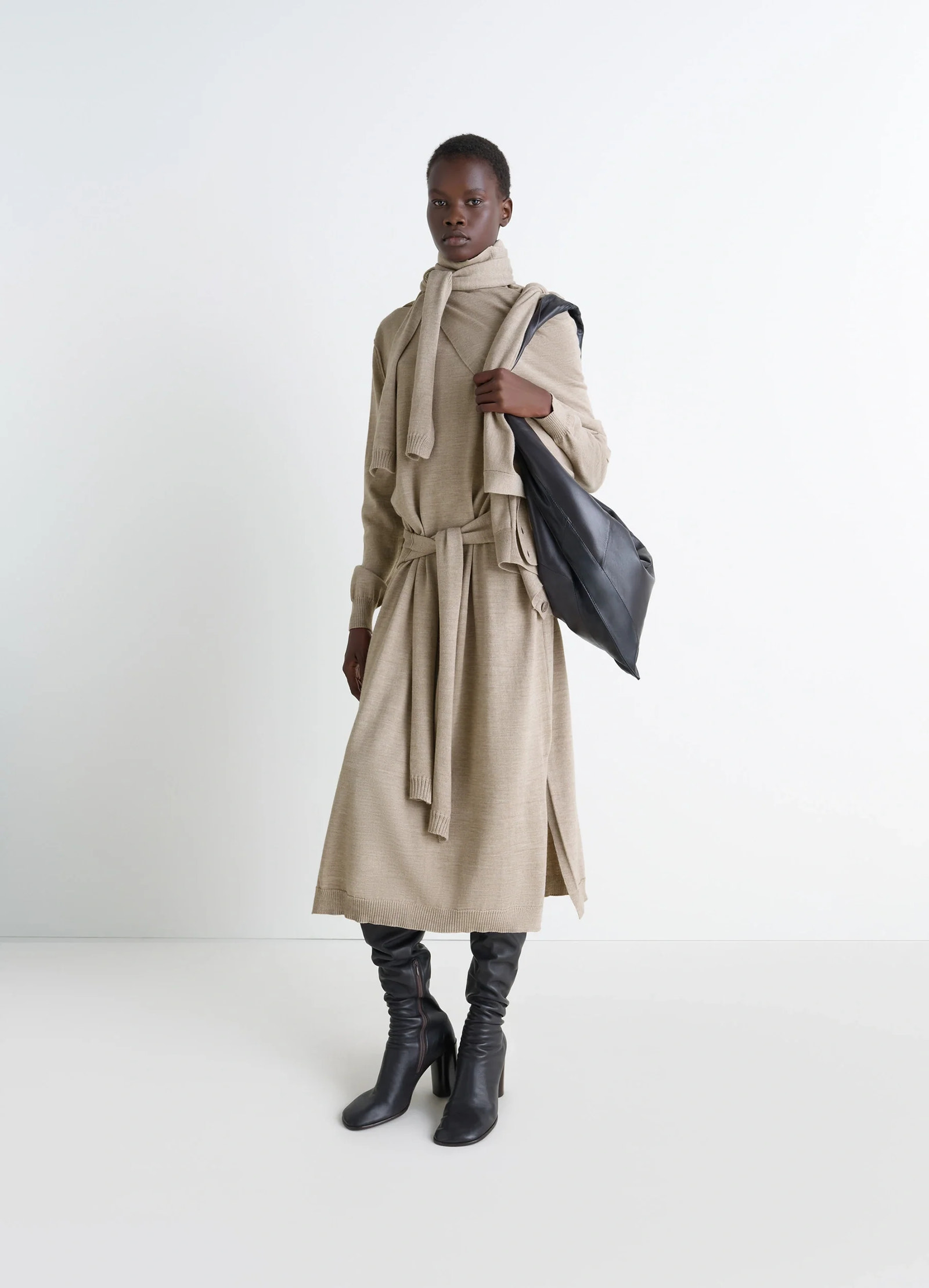 Lemaire trompe lœil dress in beige merino wool blend, model shot, front view sweater-style tie-around