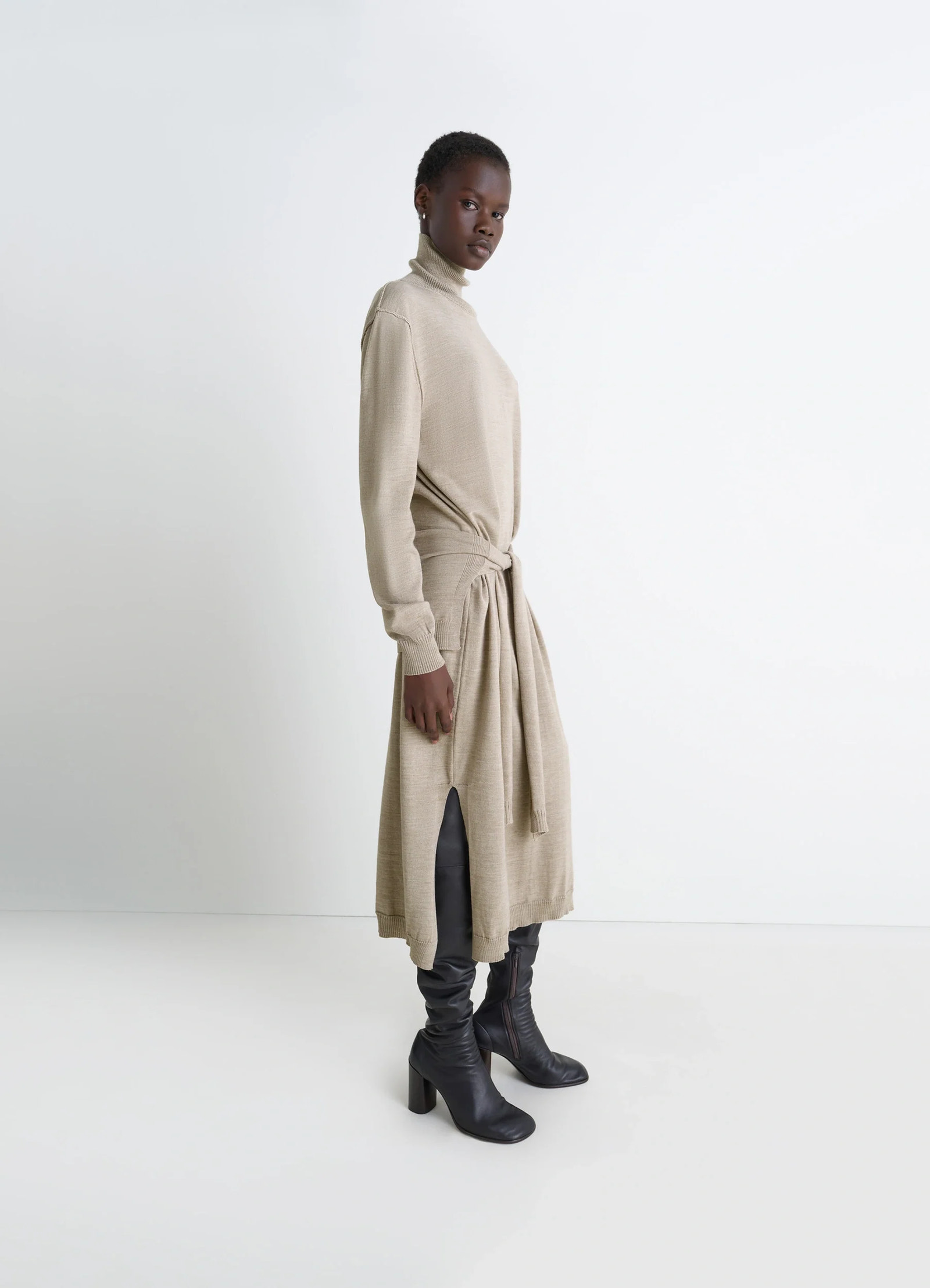 Lemaire trompe lœil dress in beige merino wool blend, model shot, side view sweater-style back panels
