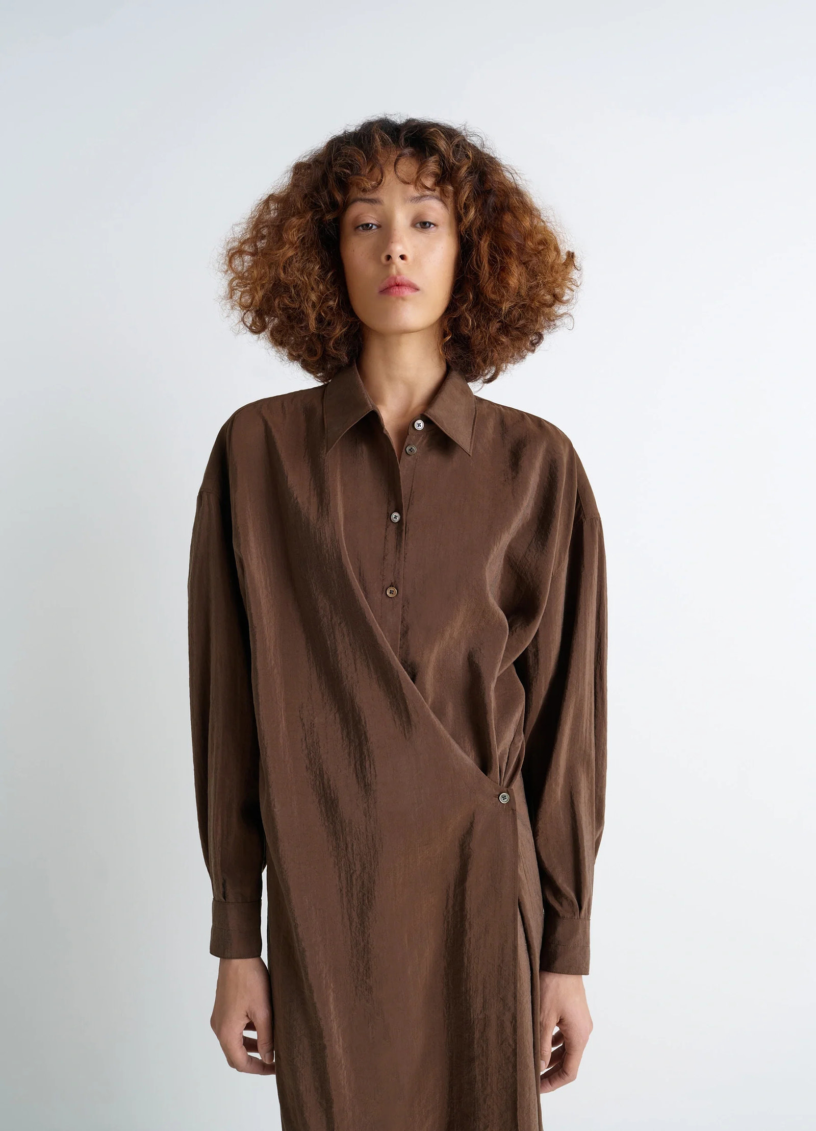 Straight collar twisted dress in brown dry silk blend, model shot, front upper half view buttoned cuffs