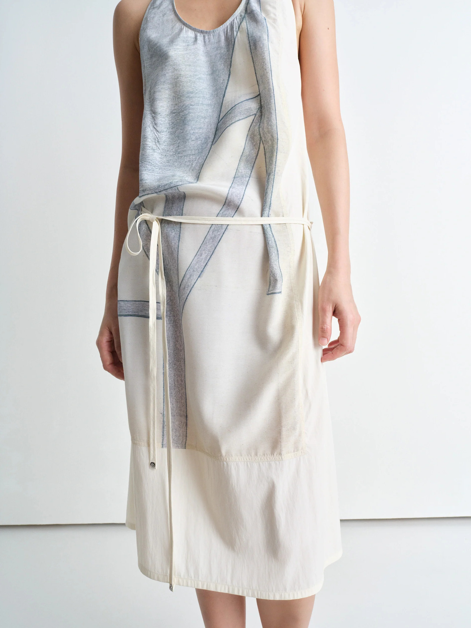 Philippe weisbecker apron dress in printed viscose technical lyocell, model shot, side angle detail loose fit with waist tie