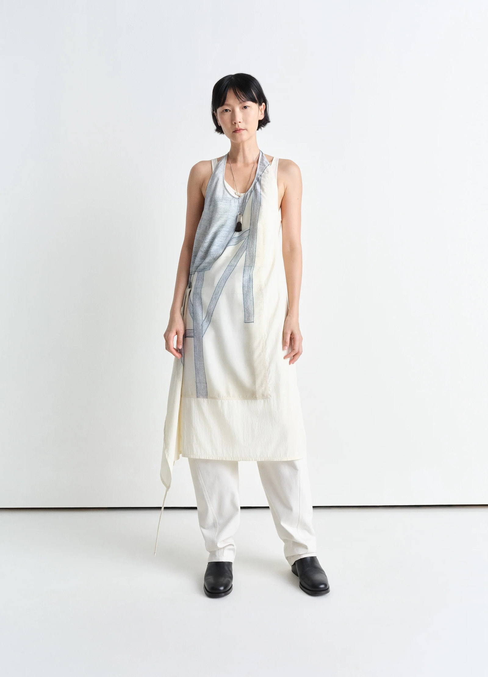 Philippe weisbecker apron dress in printed viscose technical lyocell, model shot, 3/4 front view asymmetric hem, layered styl