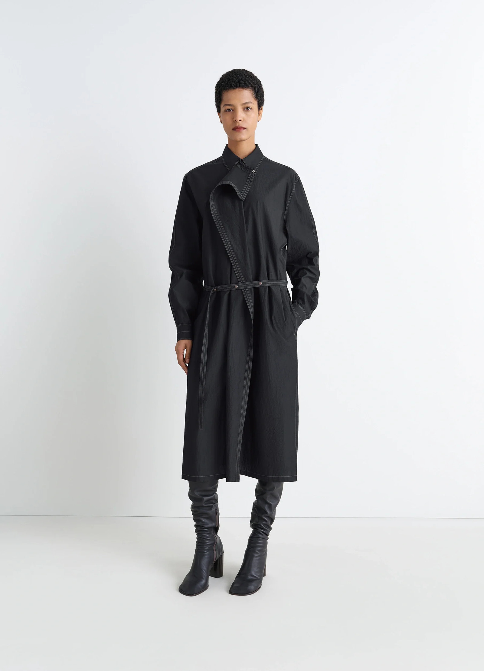 Asymmetrical shirt dress in black cotton crepe, model shot, front view asymmetrical panel