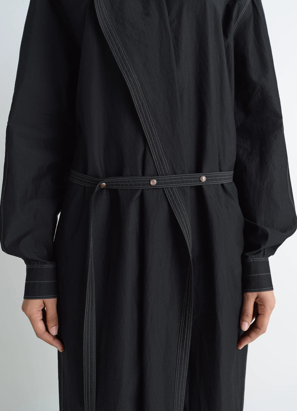 Asymmetrical Shirt Dress in Black Cotton Crepe, model shot, close-up detail waist belt and stitching