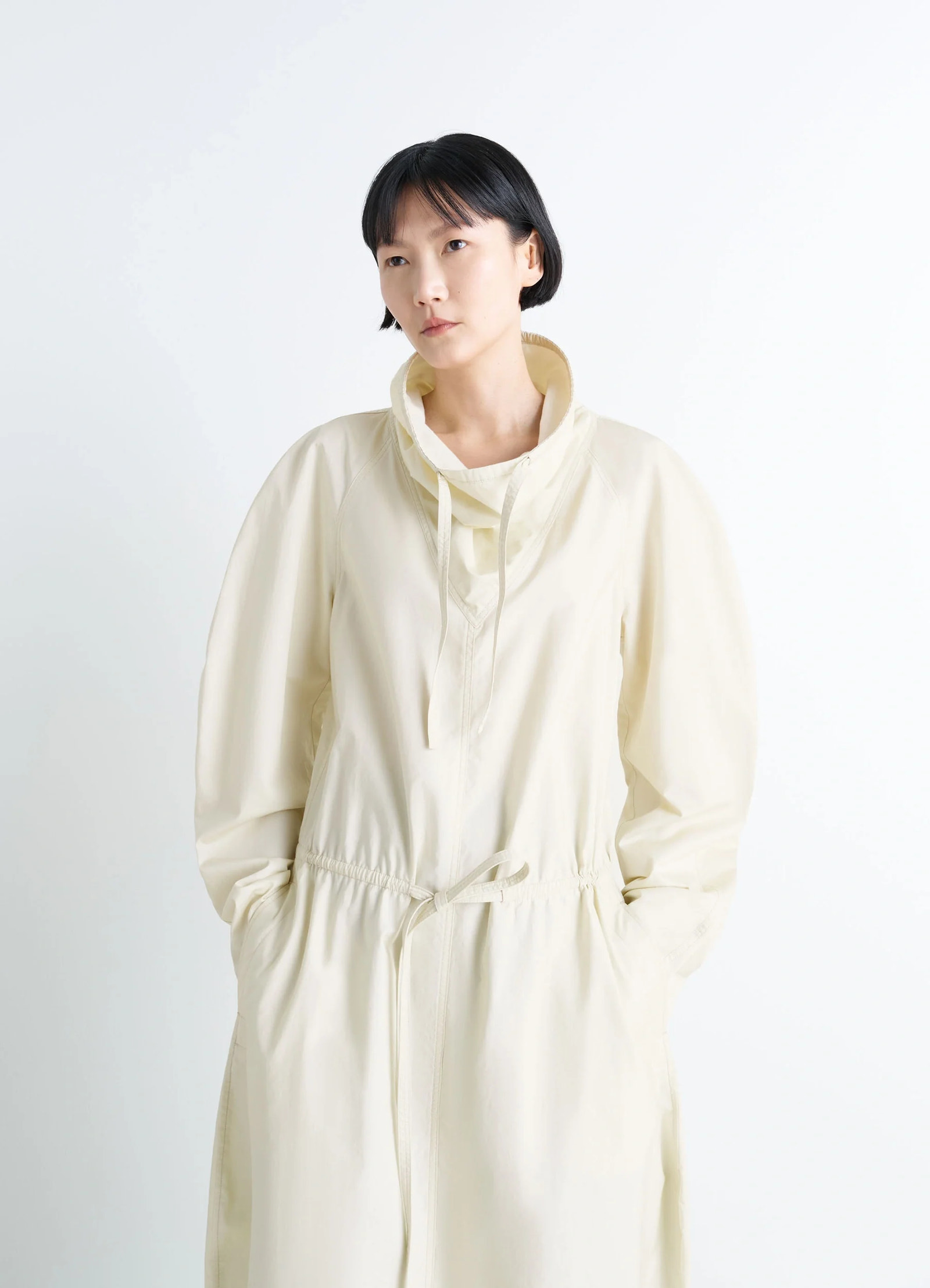 Lemaire vareuse dress in lightweight cotton satin, model shot, three-quarter view high collar, relaxed fit
