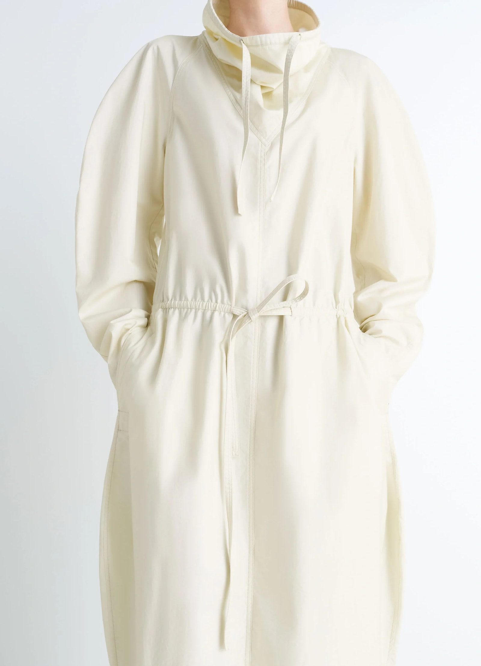 Lemaire vareuse dress in lightweight cotton satin, model shot, close-up waist view pockets visible