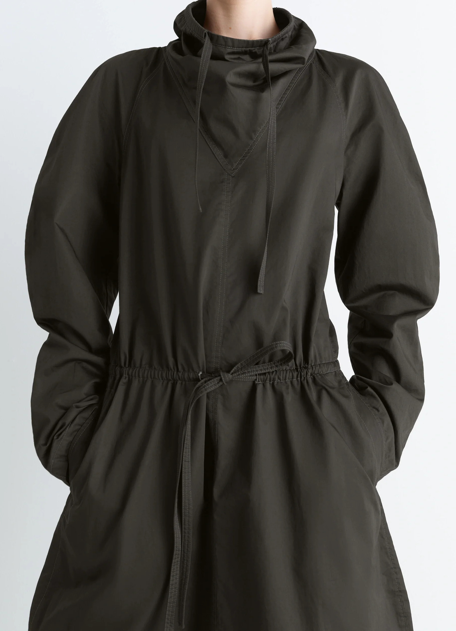 Lemaire vareuse dress in olive lightweight cotton, model shot, mid-length detail view gathered elastic cuffs
