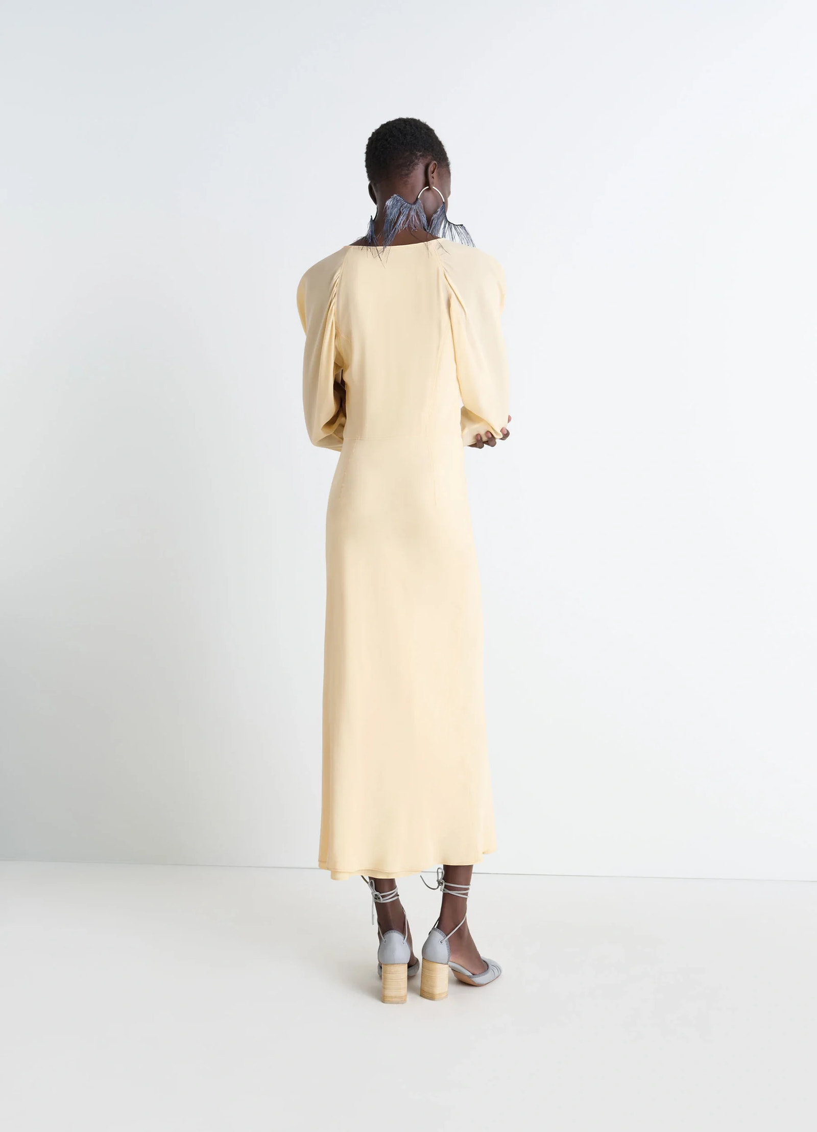 Bias cut dress in silk crepe de chine, model shot, back view puffed sleeves