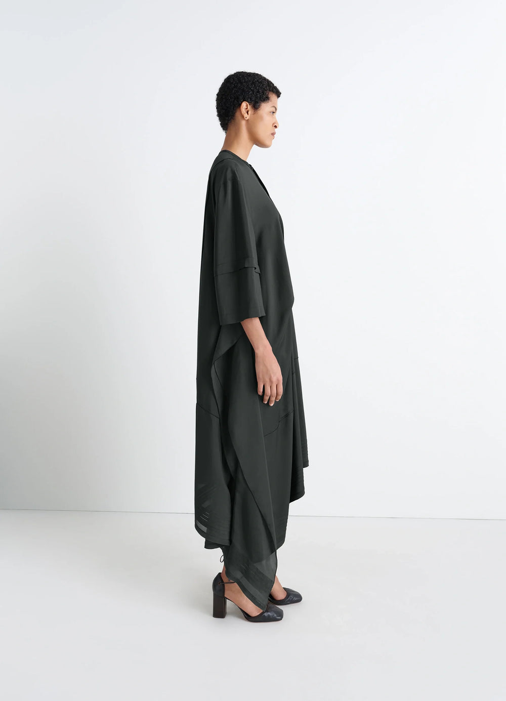Blouse Dress with Pleats in Black crêpe de Chine, model shot, side upper view draped elbow-length sleeves