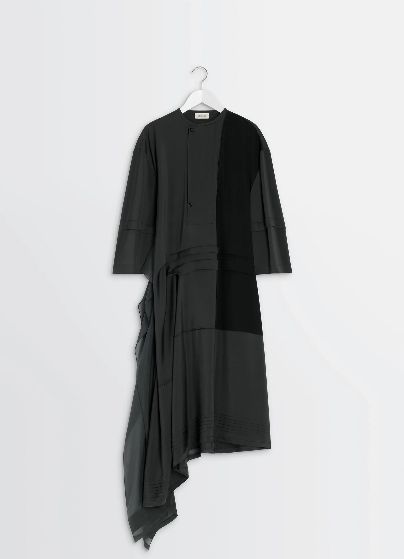 Blouse dress with pleats in black crêpe de chine, product shot, hanging detail shot central pleated panel
