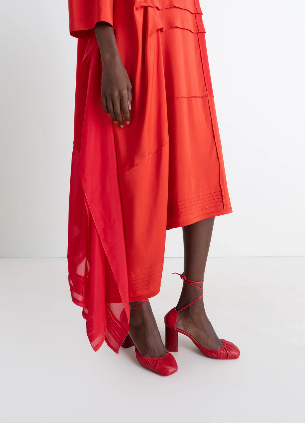 Blouse Dress with Pleats in Patchwork Crêpe de Chine, model shot, side detail view hem pleating, draped fabric