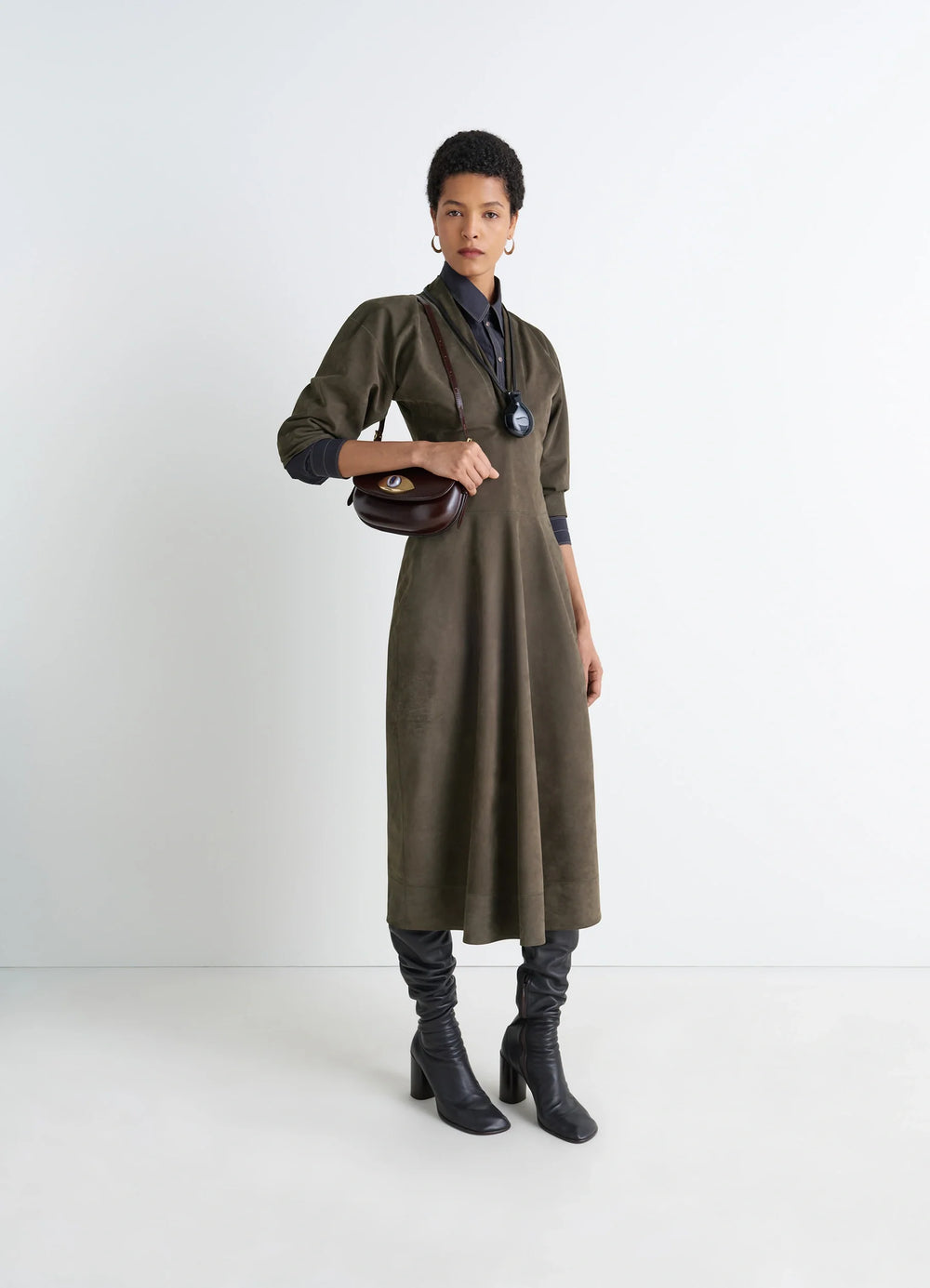 Lemaire Leather V-Neck Dress in Nubuck Leather, model shot, three-quarter view flared hem