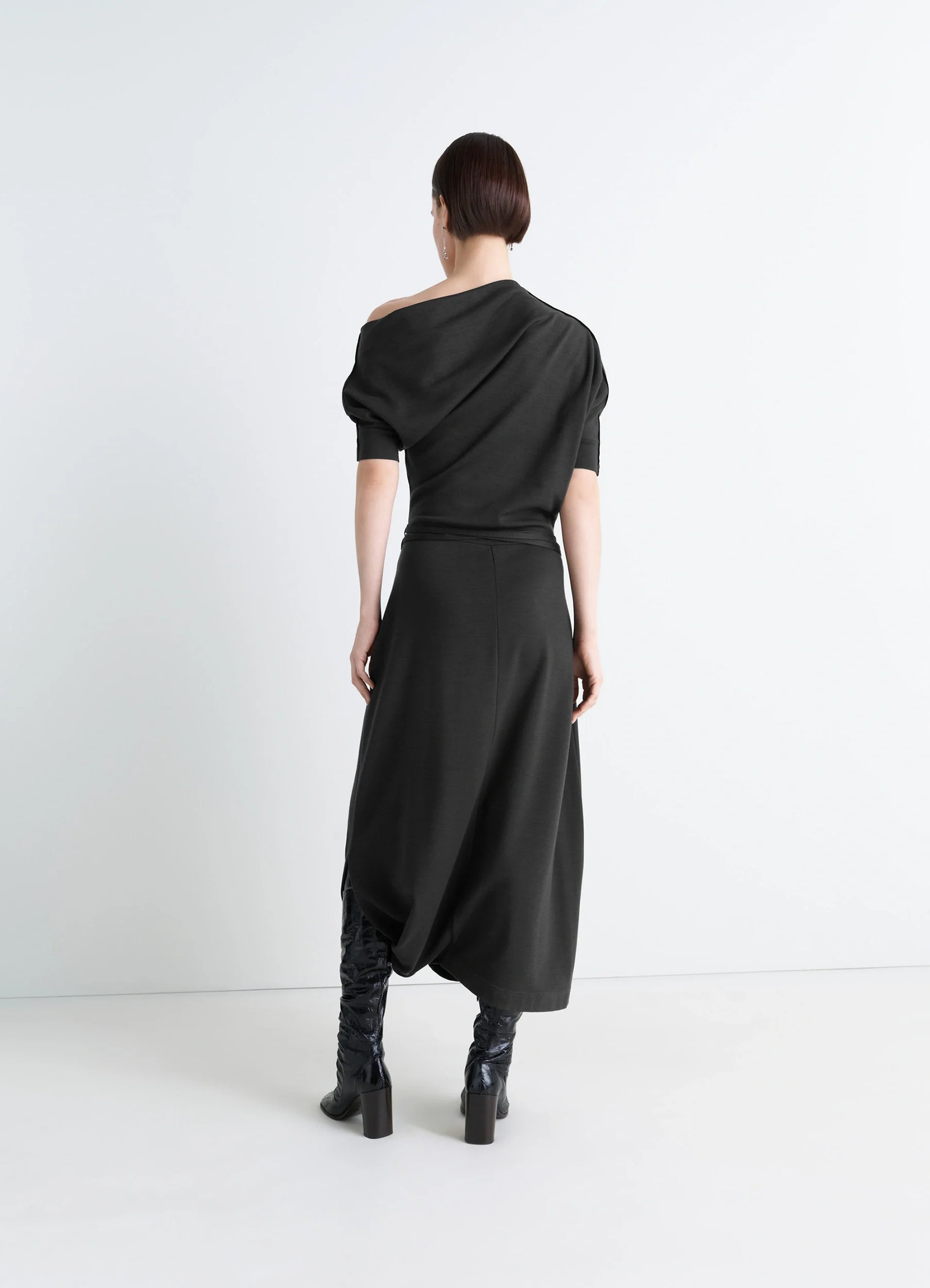 Lemaire twisted hem dress in wool viscose-blend jersey, model shot, back view twisted hem, off-shoulder