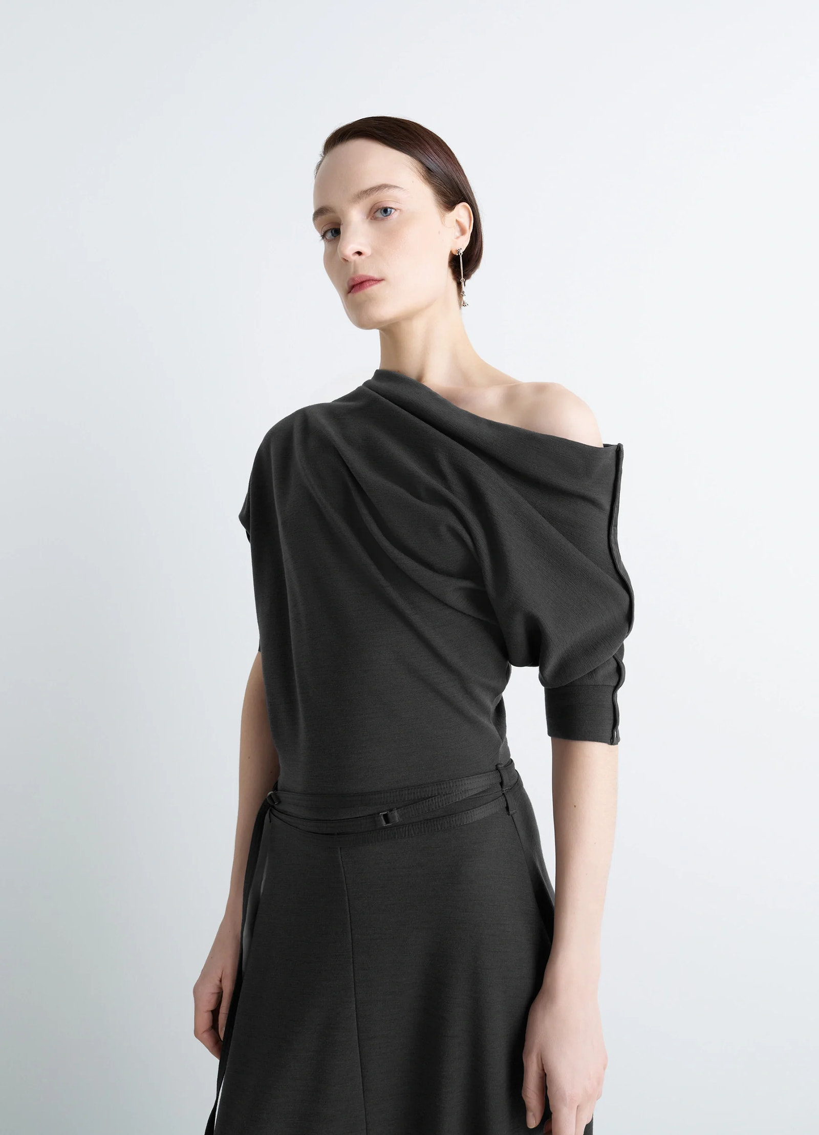 Lemaire twisted hem dress in wool viscose-blend jersey, model shot, front side view draped slender silhouette