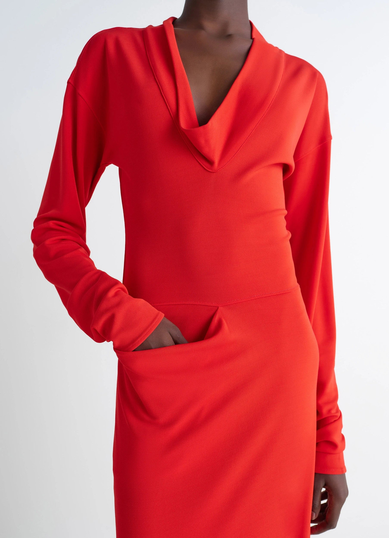 Lemaire v-neck dress in red viscose crepe jersey, model shot, three-quarter side view draped neck detail