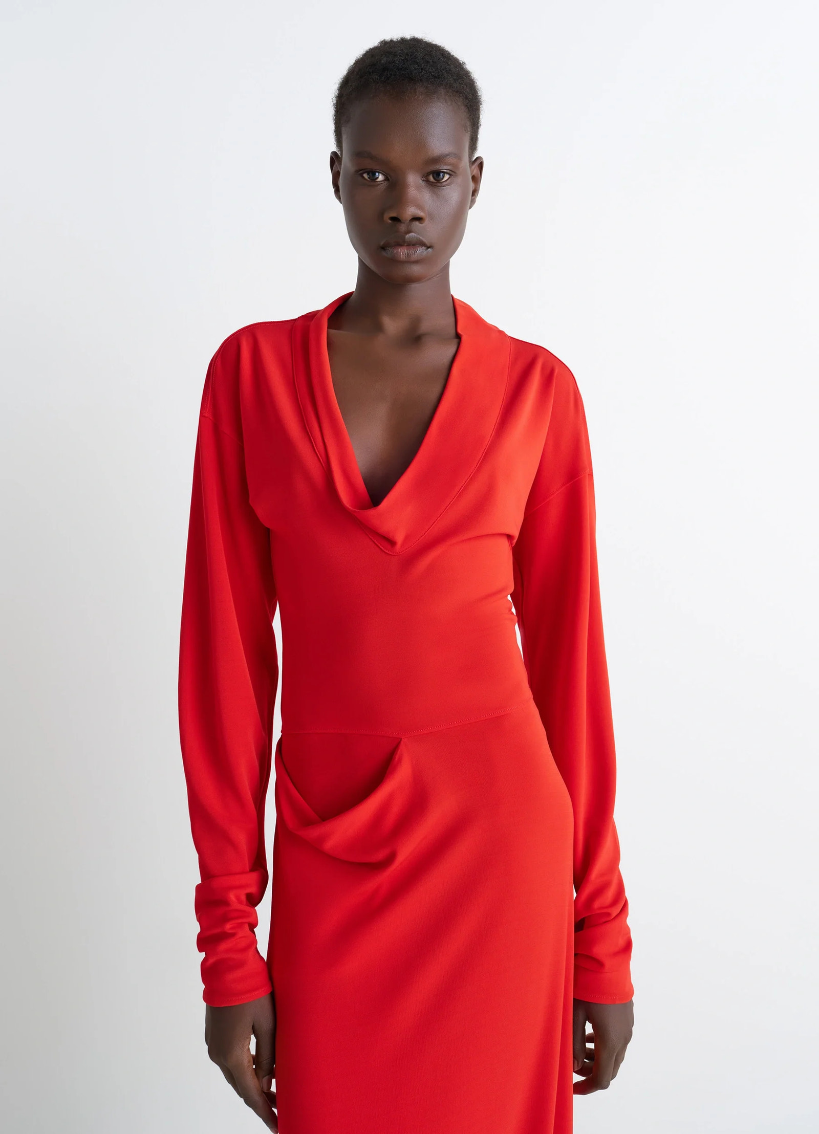 Lemaire v-neck dress in red viscose crepe jersey, model shot, close-up front view long sleeves gathered waist
