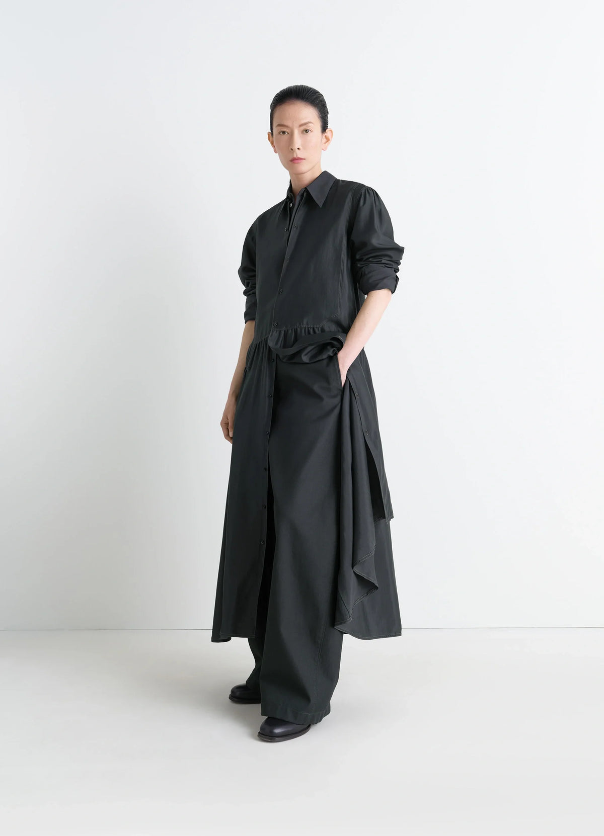 Lemaire Buttoned Dress in Silk Soft Shiny Black, model shot, Front-side view Gathered maxi volume