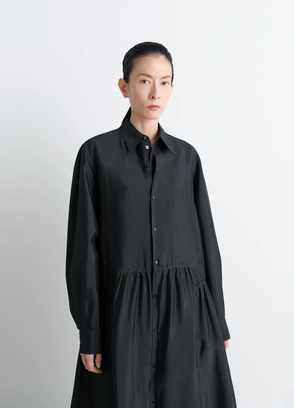 Lemaire Buttoned Dress in Silk Soft Shiny Black, model shot, upper-body view buttoned front, collar