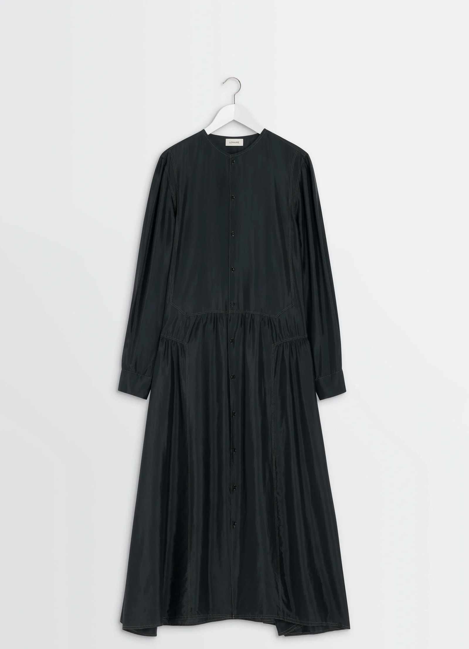 Lemaire buttoned dress in silk soft shiny black, product shot, hanger shot view clean hemline detail