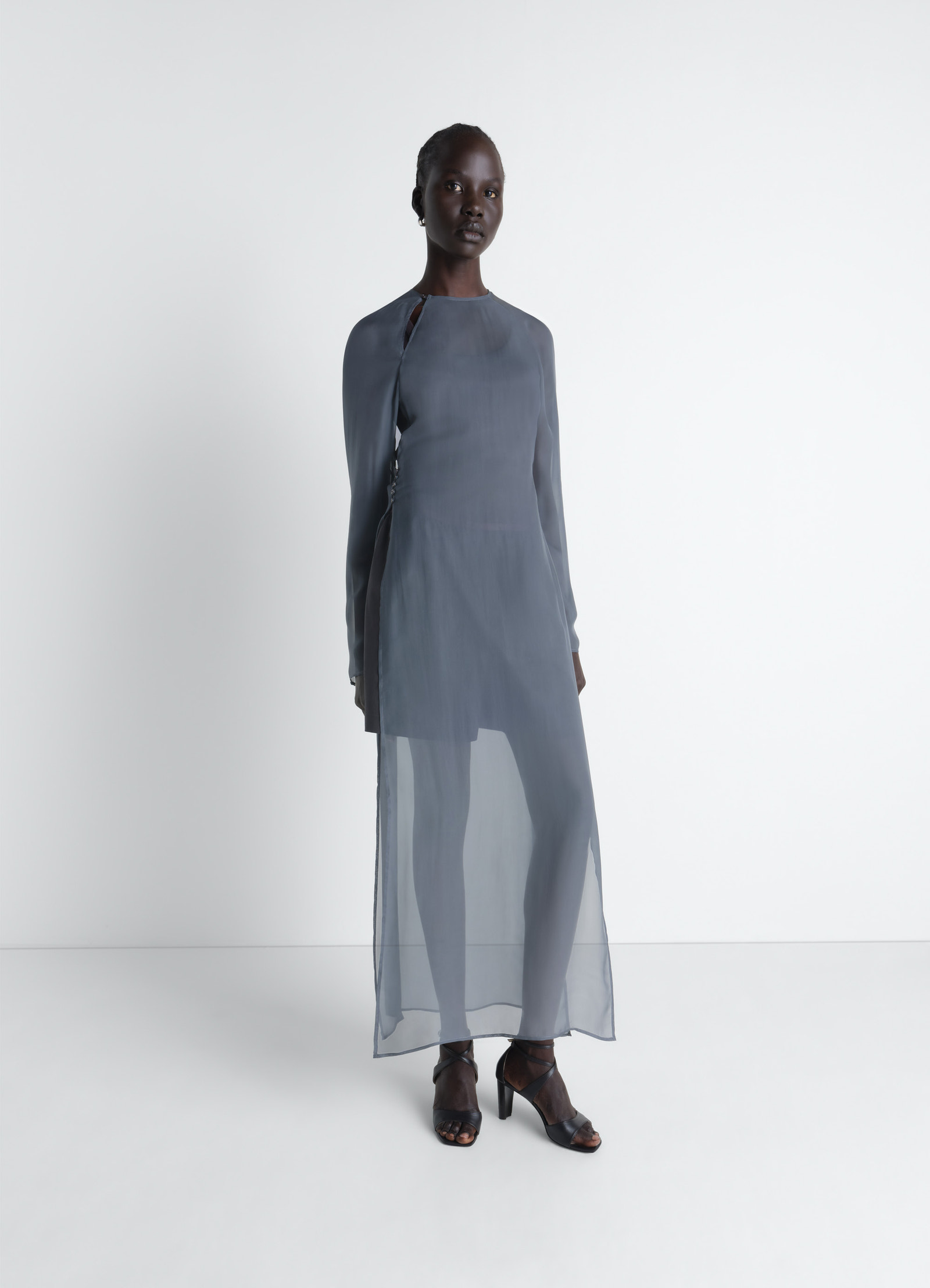 Dress with slits in transparent cup in transparent cupro, model shot, side profile view sheer overlay with side slits